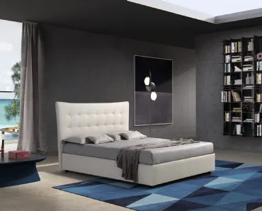 Letto dal design classico con grande testiera lavorata a leggero capitonné Parigi di Novaluna