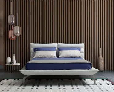 Letto in tessuto imbottito con testiera trapuntata orizzontalmente e profilo della base ridotto Remix Gls di Novaluna