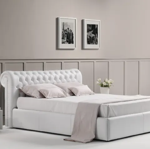 Letto in pelle imbottito con testiera lavorazione capitonnè dalle linee classiche con box contenitore Royal di Novaluna